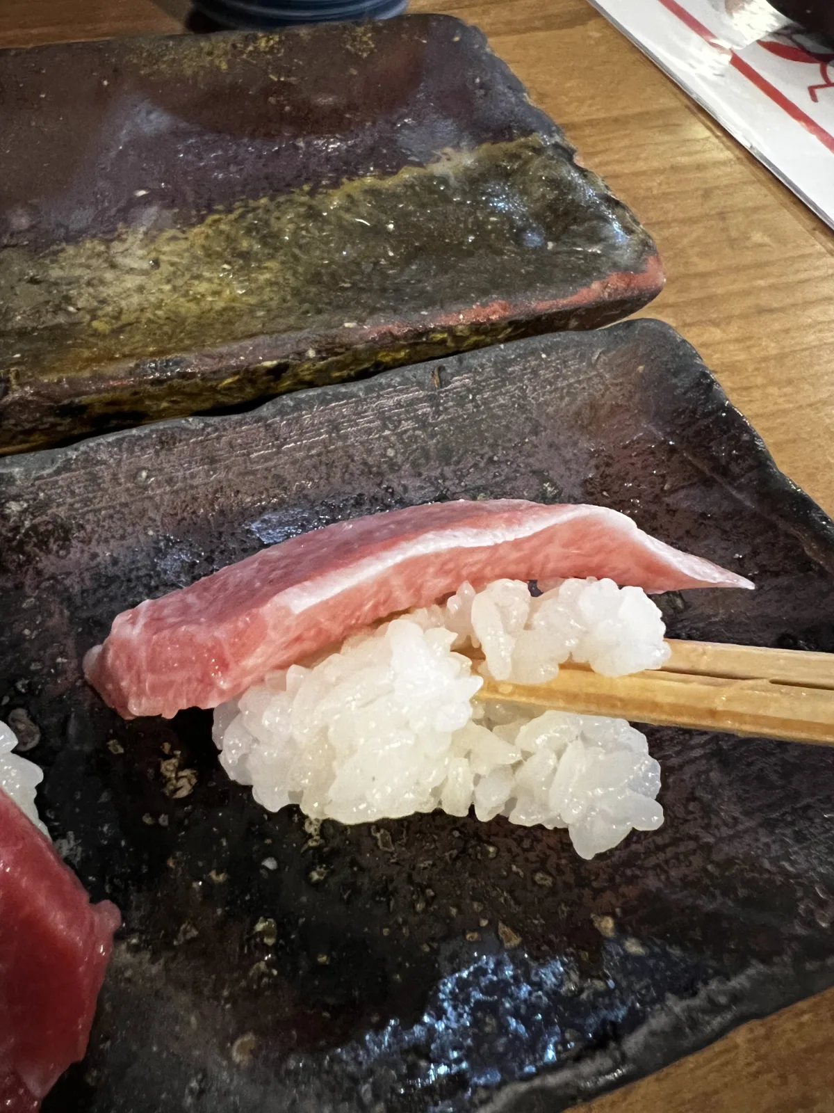 Endo sushi does Tsukami style sushi, this is different from endomae style where rice is tightly packed and doesn't fall apart. 
Tsukami style is a kansai-osakan style sushi where the rice is "fuwa fuwa" and easily dispersed, not as packed