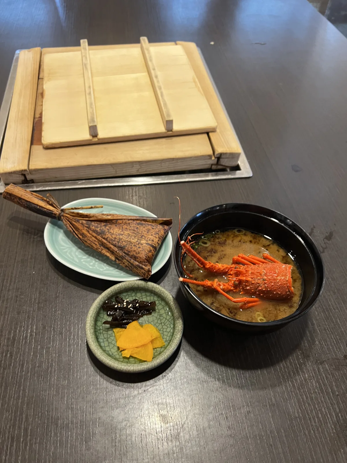 Ise Ebi Spiny Lobster soup served with rice in traditional leaf wrapping