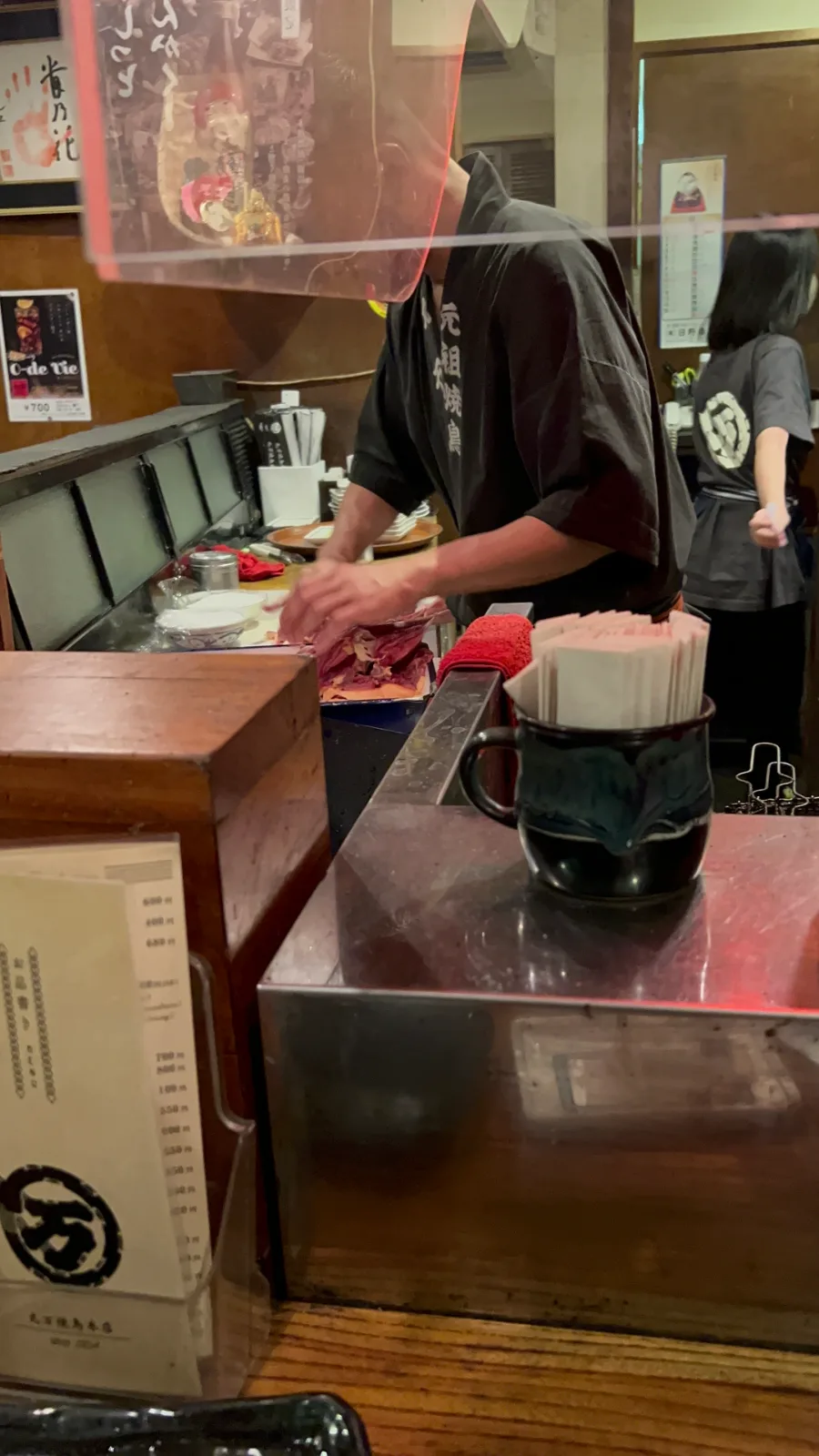 The chef is massaging the chicken.. with salt